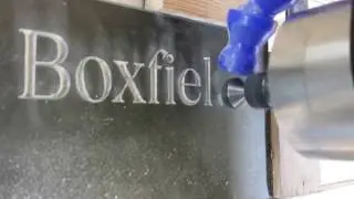Engraving a slate house plaque by Yoursigns Ltd