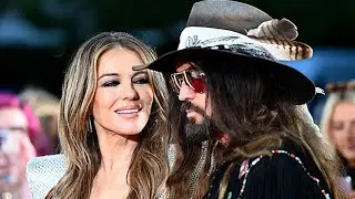 Elizabeth Hurley Hits the Red Carpet Alongside Billy Ray Cyrus and Son Damian in a Cleavage-Baring