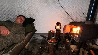 Hot tent camp in the winter forest