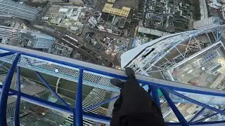 climbing a 230m crane over canary wharf