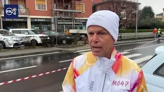 Utah&rsquo;s David Huntsman carries Olympic torch in rain‑soaked Milan suburb