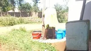 The lady behind food challenge washing clothes