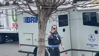 VIKING LOOKING BRINKS SECURITY GUARD ACTS AS IF HES NEVER SEEN A CAMERA BEFORE!!!