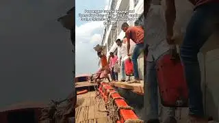 Dangerous passenger transfer between moving ship and boat.