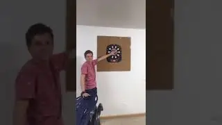 Guy puts hand on dartboard (gone wrong)