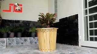 Recycle Plastic Barrels and Wood into Gorgeous Flower Pots