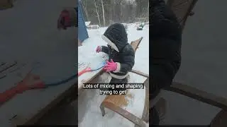 outdoor snow kitchen pretend play.  Kids having fun.