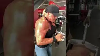 IFBB pro Tory Minehan doing tricep pushdowns with a v-bar