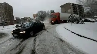 Subaru Impreza WRX towing truck in snow