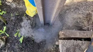 Concrete fence post installation..