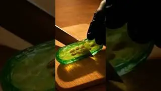 Cutting through perfection &mdash; a crystal cucumber with golden seeds, glowing under the sunlight.&rdquo;
