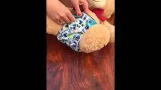 Reusable cloth nappy demonstration by Dotty Bots