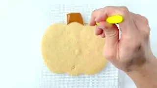 Decorating a Pumpkin Sugar Cookie