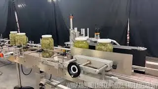 Complete line Running with Pickles bottles, filling, capping and labeling by Acasi Machinery Inc