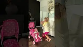 Sweet Naomi puts her dolls in the stroller. Cute Baby Videos!