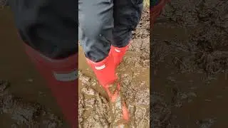 Red Hunter wellies in mud.