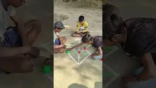 Two friends played an amazing game in the village with a red ball and a green ball.