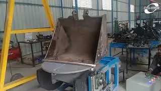 Rotary positioner by Cyclotron automation (Backhoe bucket manipulator)