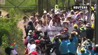 Activists march after crossing inter-Korea border
