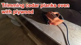 DIY Sailboat - Trimming hull bottom planks even with the plywood.