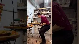 Food runner Ivan carrying two full trays with absolute precision. A true master at work!