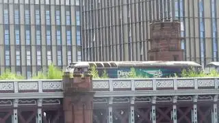 DRS 57303 'Pride of Carlisle' drags 320304 on the 538D Shields T.M.D. (E) to Glasgow Works