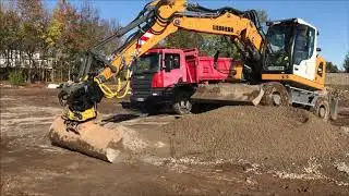 Pelle sur pneus Liebherr Group A914k compact avec Tiltrotateur Engcon EC214.