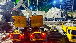 A team of machinery is digging the ground to make money for the canal and road