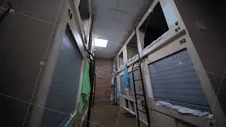 Compact hostel sleeping pods providing privacy and comfort for budget travelers
