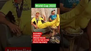 world cup 2023 Australian cricketer Mitchell Marsh with his feet on the World Cup trophy