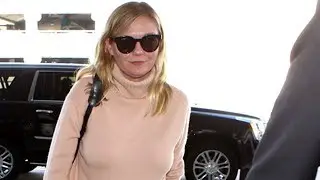 Movie Star Kirsten Dunst Breezes Through LAX