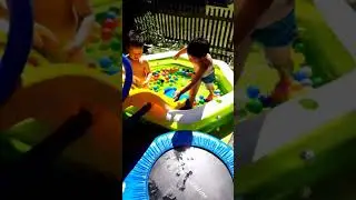 Summer 2020 kids playing waterslide corona Pandemie freetime at home