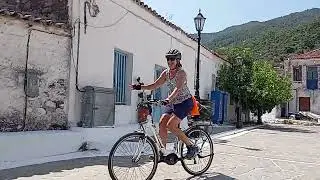 A group of friends having fun in a small village in Greece with guided e bike tour
