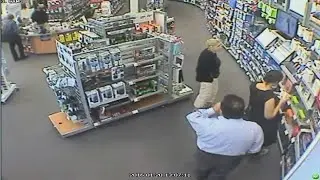 Woman caught on camera stuffing electronics under dress