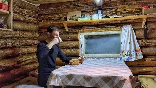 I hid in a log cabin from the intense cold! I'm going to light a wood-burning stove to keep warm!