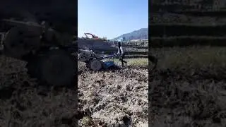 Driving  tractor in nepal field..