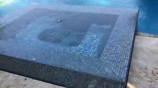 All tiled perimeter overflow spa.