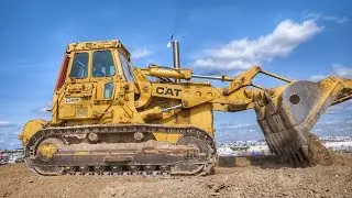 Cat's Largest Tracked Loader Leveling Dirt