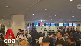 All runways at Tokyo's Haneda airport closed after Japan Airlines plane catches fire