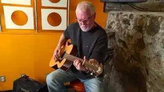 Norm Taylor on Guitar wearing ROLF Spectacles
