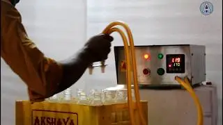 Bottle filling machine / Syrup filling machine (Two nozzle) -Akshay Industries