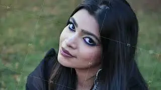 Young Indian woman posing smiling in Moscow park