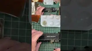Weathering the RS-1 under frame. We used AMMO by MiG Kursk Soil paint, and Dark Earth pigments.