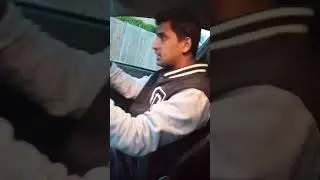 A boy dancing while driving in London