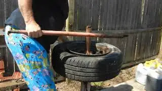 AN OLD MAN AND HIS MANUAL TIRE CHANGER