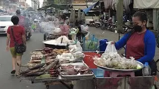 Street food in evening at Olympic Market Phnom Penh Cambodia