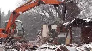 House Demolition And Debris Removal During Snowstorm (HD)