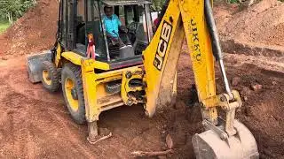 Jcb 3dx digging and gathering soil
