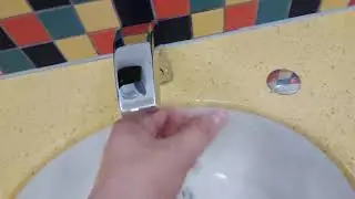 Unbranded sink with tap and push button hand dryer at Metrocentre Shopping Centre in Metrocentre