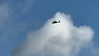 Private Eurocopter EC155 [G-HCNX] flying near the distance